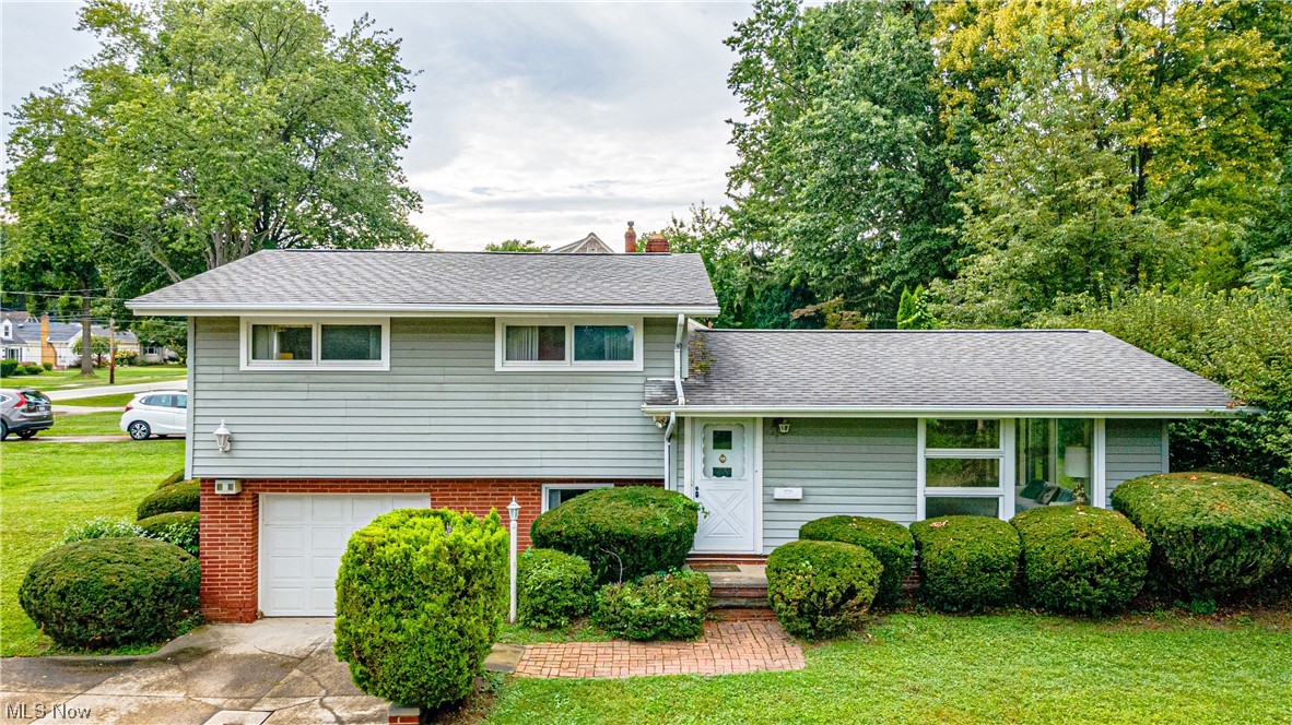 Welcome home to this beautiful, move-in ready 3 bedroom split-level in Westlake! Located on a beautiful lot that is close to schools, recreational centers, and much more. The home has a great designed layout plan that begins with a very spacious vaulted living room with wood beam and floor to ceiling windows. This room opens up to both the dining room and kitchen. Walk out the back sliding doors to the concrete patio. The lower-level has a finished area and separate laundry room (washer/dryer stay). Attached garage with storage shelves in back. The upstairs offers 3 bedrooms and a full bathroom. Some updates throughout the home include new central air (2022), newer hot water tank (2021), kitchen refrigerator (2021), and furnace (2009). Call now for your private tour!