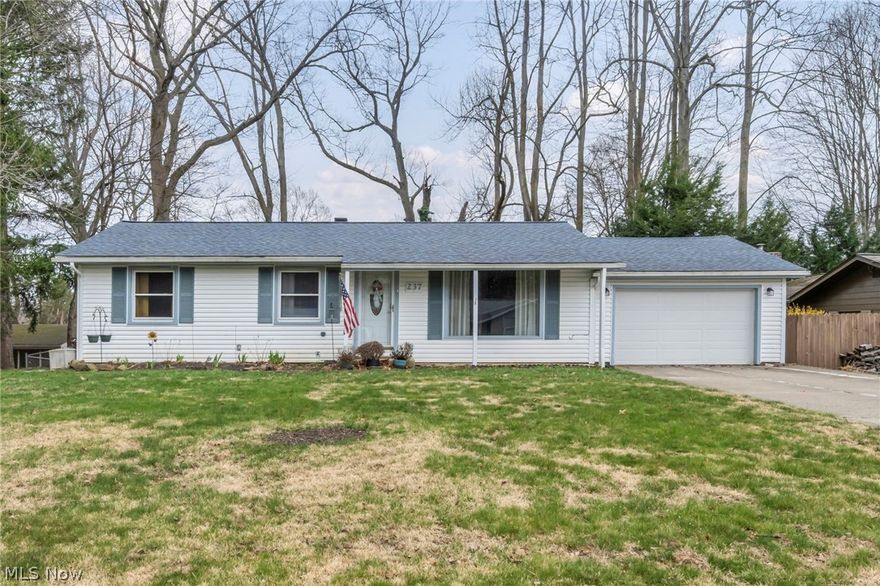 Welcome to this well-maintained 3-bedroom, 3-bath home offering space, flexibility, and opportunity! Situated on a nicely sized lot with a gently sloping backyard, this property features a large deck and an enclosed sunroom—perfect for relaxing, entertaining, or enjoying peaceful outdoor views in any season. Inside, the main level offers a comfortable and functional layout, highlighted by a spacious family room featuring a gas fireplace. This inviting space seamlessly opens to the enclosed sunroom, creating an ideal setting for both everyday living and entertaining while bringing in an abundance of natural light. The enclosed sunroom serves as a true extension of the living space and provides direct access to the expansive deck, making indoor-outdoor living easy and enjoyable. The lower level offers significant additional usable space, including a large, finished recreation area with built-in shelving, multiple-flex rooms, and a dedicated laundry area. A convenient lower-level bathroom adds functionality, making this space well-suited for a variety of uses such as a home office, hobby area, or additional living quarters. Storage is abundant throughout, with built-in cabinetry, closet space, and a spacious utility/laundry room. The attached 2 car tandem garage provides additional storage and parking, while the backyard offers privacy and room to enjoy outdoor activities. Recent updates over the years provide a solid foundation while still allowing a new owner the opportunity to make cosmetic improvements and add personal touches. Conveniently located near local amenities, shopping, and major roadways, this home offers both accessibility and a comfortable setting.