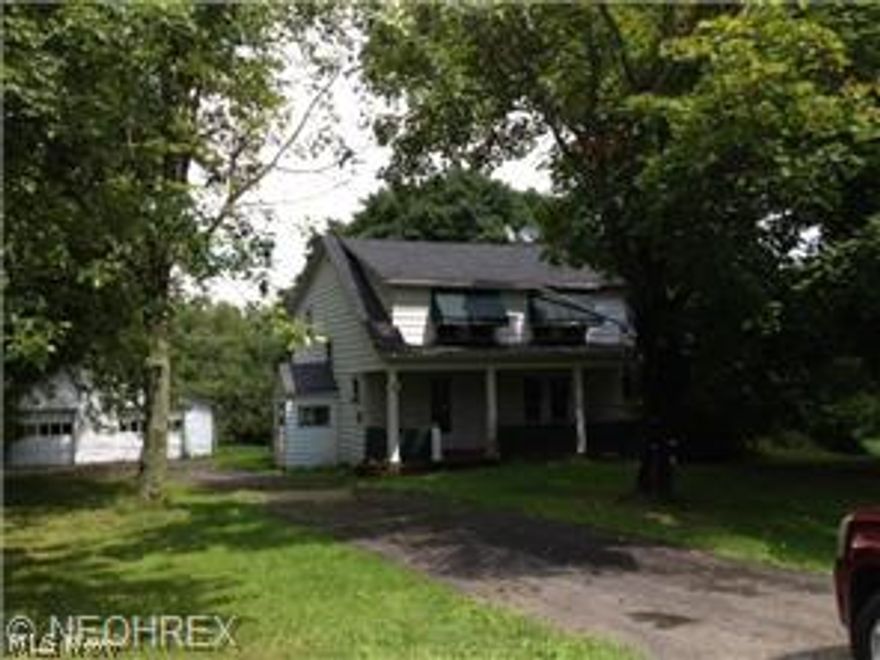 4 bedroom cape cod close to Ohio/Pennsylvania line. Home has detached garage, grape arbor, large backyard. 1st floor bedroom, laundry and bath. New off lot septic system in 2006.  Small additional parcel