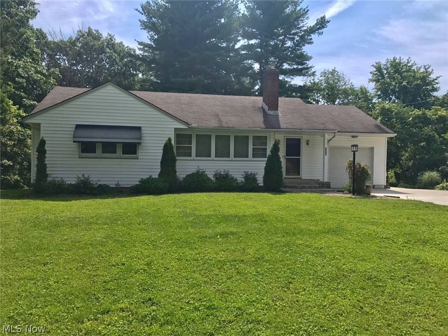 Welcome home to your private oasis on 1.74 Acres in Hudson Schools! This charming and well-maintained Ranch has so much to offer including solid oak wood flooring throughout, open & inviting living space, two fireplaces and large windows. The dining room, located just off the kitchen, is open to the living area with direct access to the large deck overlooking the serene treed lot.  Enjoy cooking in this updated kitchen that is complete w/stunning oak cabinetry, black granite counters, and stainless steel appliances. The master bedroom is generously sized with ample closet space. You will love every bit of the updated full bath located on the main floor featuring unique marble flooring & elegant back splash tiling on the surround.  Extra entertaining space awaits in the finished basement perfect for a TV or game room.  If you need to get away from it all, step outside and follow the stone pathway to your very own wooded retreat.  Whats left to do? Move right in! Come see for yourself. C