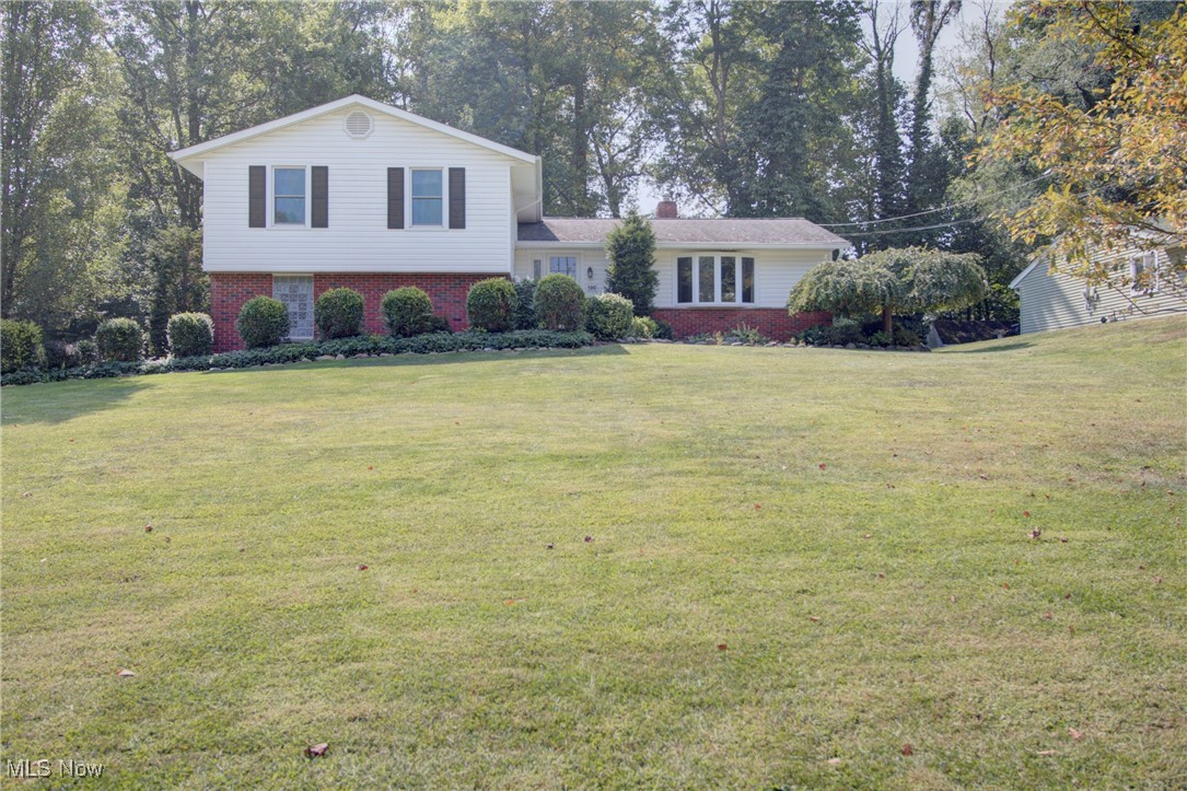 Welcome home to this rare find, conveniently located in the heart of Northfield, in a desirable, established neighborhood with beautiful homes and large, park-like yards. This stunningly updated split level with 3 bedrooms, 2.5 baths and loads of space includes 4 levels totaling 2650 square feet! The newly remodeled kitchen is a showstopper with 50k spent in upgrades, featuring high-end stainless steel appliances, granite countertops, and abundant cabinetry, and now opens seamlessly to the dining room and spacious living room. Recessed lighting & a large picture window fill this space with plenty of light. The upper level hosts 3 bedrooms, including a primary suite with a walk-in closet and ensuite bath with a brand-new shower. A hallway bath serves the secondary bedrooms, while a convenient walk-in linen closet and attic storage add to this home’s impressive storage options. The flooring was updated throughout with warm, espresso-stained hardwoods in the bedrooms and luxury vinyl tile in the remainder of the home. On the ground level, you’ll find a cozy family room with a fireplace, sliders to the outdoors, and access to a charming 3-season sunroom—perfect for relaxing or entertaining. Just beyond the sunroom is a beautiful paver patio with decorative block landscaping, making it your own private oasis - the outdoor space is a must see! A half bath is conveniently located on this level, as well. The 4th level features a huge basement with fresh paint and vinyl flooring that makes an excellent recreation room or hobby space! Other notable updates include the furnace in 2023, AC in 2021 and fresh paint throughout much of the home. This home is truly move-in ready, combining thoughtful updates with plenty of space for everyday living and entertaining.