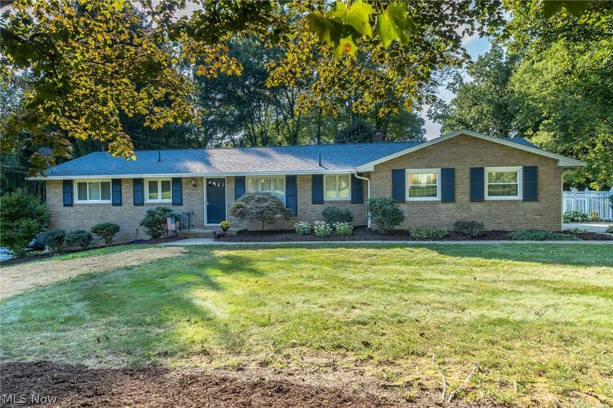 Attractive brick ranch with walk-out,finished lower level! This impressive home will have you the minute you walk through the front door. Inviting hardwood floors flow throughout the first level. The updated kitchen has pretty white cabinets and newer appliances. Unbelievable backyard can be accessed from the kitchen and the lower level. It has a pretty white vinyl fence that encompasses the whole backyard and has three access points for convenience. Buy now and enjoy the fall relaxing on this homes very large deck! Two full baths, two fireplaces, vinyl tip-in replacement windows and the shingles were done around ten years ago! You won't be disappointed here!