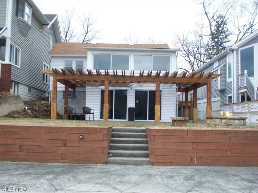 Affordability in Portage Lakes!! This 3 bedroom home has 40' of water frontage with a dock.  The lower level has the kitchen and living room, and walks out of multiple sliders to the water.  There is stamped concrete, a gas fire pit, and patio.  The master bedroom over looks the water.  The kitchen is updated, and has newer appliances.  The paint and carpet are new.  There is a two car garage, office, sump pump, and much more.