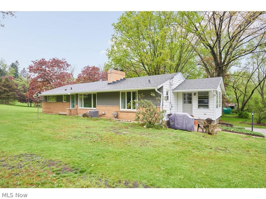 Don't miss out on this beautifully updated 4 bedroom Ranch situated on 1.5 acres in Bath Twp. Ideal location near Cuyahoga Valley National Park with quick easy access to shopping and the highway. You will appreciate the fresh neutral decor and hardwood floors. Relax in the owner's retreat complete with its own fireplace and updated en suite. The bright cheery kitchen leads to a sunroom with direct access to the sprawling backyard. There is unlimited potential in the walk out basement for a bonus/family room complete with a 3rd fireplace and covered patio. Tons of space for all of your toys with an additional 2 car detached garage. Extensive list of updates includes roof, concrete driveway pad and much more. Call today for a complete list of updates and to schedule a private showing!