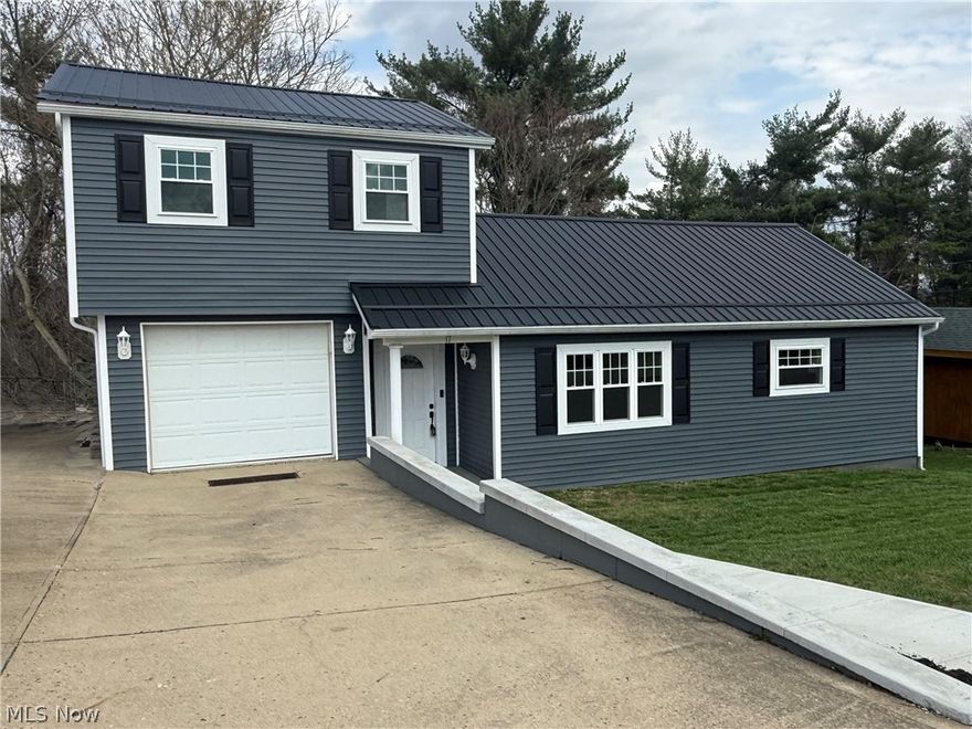 Completely remodeled inside and out,  literally turn key,  with new roof, siding, windows, doors, furnace, central air, drywall,  lighting, electrical, flooring throughout and all new brand kitchen and bathrooms  and mostly new plumbing.   Come check out this amazing renovated home where seller has exquisite taste w new stainless steel appliances  and Corian countertops, oversized living room with dining area and first floor master suite and full bath.  New slider leads to the private screened in porch to sit and relax on.    There’s an office in the walkout basement with laundry room and the whole house has been painted on the inside.  Outside you will find paved off street parking and one car garage and new sidewalks, and several layers of decks and balconies and a wooded backyard.   The home is situated on 2 lots with city water and septic.  Seller to retain mineral rights.   Call today to view this amazing home.