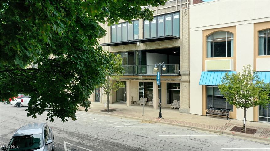 Experience modern luxury in this brand-new 2-bedroom, 2-bath condo offering 1,493 sq ft of living space in the heart of downtown Sandusky. Thoughtfully designed within a beautifully restored historic building, this home features soaring 12-foot ceilings, wide welcoming hallways, and an inviting foyer. The open-concept kitchen and family room look out over Sandusky Park and flow seamlessly onto a walk-out balcony with folding glass doors that bring the outdoors inperfect for entertaining and holiday gatherings. The primary suite offers a spa-like retreat with a soaker tub, walk-in shower, and marble bathroom floors. The second full bath is equally well-appointed, with marble flooring, while ceramic tile runs throughout the rest of the condo for a modern, cohesive feel. Additional highlights include in-unit laundry room, a pantry closet, and the opportunity for buyers to personalize the kitchen by selecting cabinet and countertop finishes from a curated design collection. The kitchen will be installed within 6-8 weeks of an accepted contract, ensuring a fresh and customized space. This exceptional condo combines historic charm with contemporary elegance, all within steps of Lake Erie, shopping, dining, and vibrant downtown Sandusky.