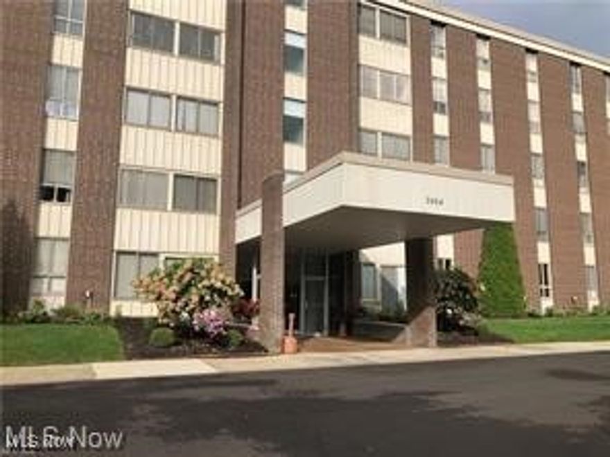 Here's an attractive 2 bedroom condo that has been tastefully updated and well maintained. The spacious living /dining room combination gives a nice open feeling. This area has crown molding and new luxury vinyl floors that continue throughout the condo.  The  cozy 4 seasons sun room offers beautiful views of the wooded back yard. The eat in kitchen is attractive with light colored cabinets, new quartz counters  and  a delightful custom mural and custom blinds in the eating area. Large primary bedroom with double closets. The building has a secure entrance, attached garage, assigned parking, laundry and extra storage on each floor. The exterior is surrounded with expansive green grassy lawns, sitting areas, wooded areas, and an inground swimming pool and clubhouse. In Building D you'll find a community  library/game room, exercise room, full kitchen / meeting room and hotel room for overnight guests. All utilities included in the monthly fee. Welcome home to this friendly and peaceful 55+ community.
