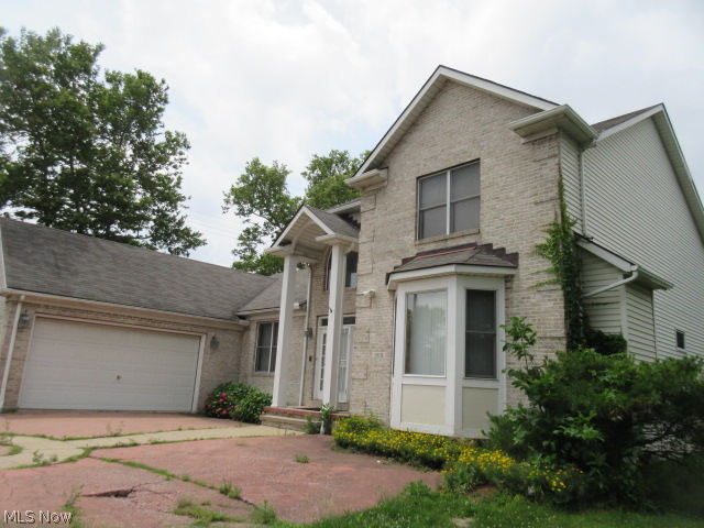 Sharp looking brick and vinyl sided colonial conveniently located near the Cleveland Clinic Campus. Private, partially fenced rear yard with mature landscape. Unique driveway and patio design with colored concrete design. Dramatic floor plan offering vaulted ceilings, as well as a highly sought after first floor master bedroom offering a fireplace and glamour bathroom. Fairly neutral color schemes remain thru-out. Full, finished basement with wet bar, and full bath perfect for entertaining. Tremendous value here on this newer construction home offering nearly 3,400 sq ft of living space!