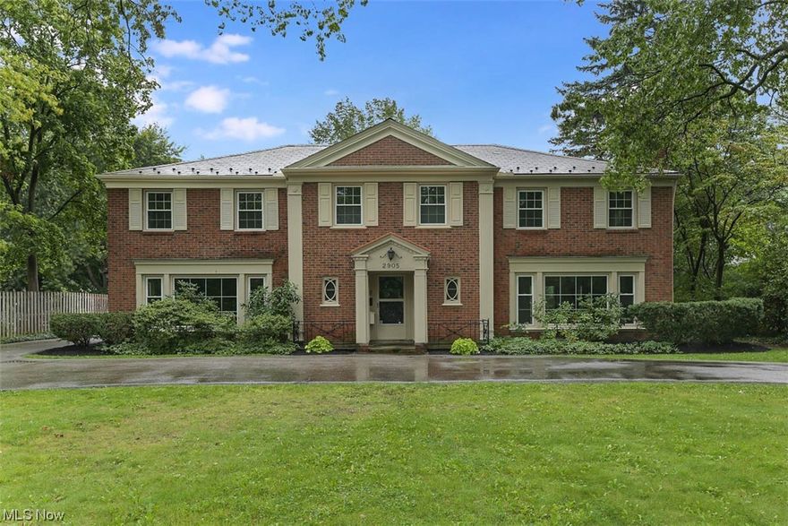 This remarkable all brick home is a true combination of elegance and comfort. With five spacious bedrooms and four and a half modern bathrooms, there's no shortage of space. This home has been thoughtfully updated in 2018 to meet the demands of modern living while preserving its classic character. The interior features have been meticulously chosen to create an inviting atmosphere. Hardwood floors gleam underfoot, guiding you through the open layout that effortlessly connects the living spaces. The heart of the home is the gourmet kitchen, a space that is as functional as it is beautiful. Adorned with stainless appliances, granite countertops, and beautiful cabinetry, this kitchen is a dream come true. The breakfast room and sunroom have classic tile flooring and floor to ceiling sliding doors, offering picturesque views of the lush landscaping that surrounds the property. The oversized first floor office provides a great place to work from home. The primary bedroom suite has a spaciou