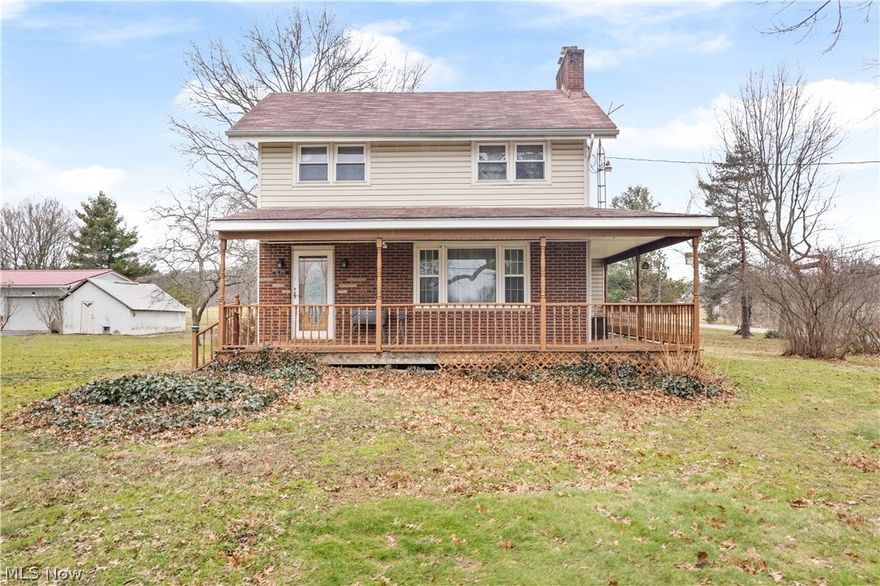 Set on a wide-frontage corner lot with 6.99 sprawling acres along Industry Road, this peaceful country property feels like home the moment you pull in. Warm farmhouse character runs throughout, with hardwood floors, built-in storage and custom cabinet inserts, making everything feeling solid and peaceful. The kitchen offers a comfortable, spacious cooking area with a brand-new refrigerator(2025). The washer and dryer stay to make move-in easy.  Over the years, the big-ticket items have been thoughtfully updated, including a 2018 furnace, 2019 central air/heat pump, water softener, newer plumbing in 2025, glass block basement windows, and a sump pump with battery backup and water filtration. Some main-level windows were replaced in 2015, with the dining room windows updated in 2010, and the septic pumped (2026) and a new well pump (2025). Outside, there's plenty of room to spread out and enjoy country living, whether you need space for hobbies, storage, or small-scale farm use. You'll find a 40x30 garage (roof and siding work completed in 2025), a milk house with a 2018 roof, a shed, and a charming bank barn with a roof updated in 2006, complete with indoor stalls, electricity and water hookups. The downspouts at the barn and garage have been rerouted, newer soffit over the porch (2021), and an open-frame, wrap-around porch all add to the inviting farmhouse feel. The basement has an abundance of finished living area as well as lots of storage area to give you a head start on organization. The home also offers a wood-burning stove for those who appreciate the comfort of multiple heat sources on chilly country nights. The paved turn-around driveway offers convenience for daily use and for gatherings. Don't miss this rare opportunity at this dream-like setting, schedule your private tour!