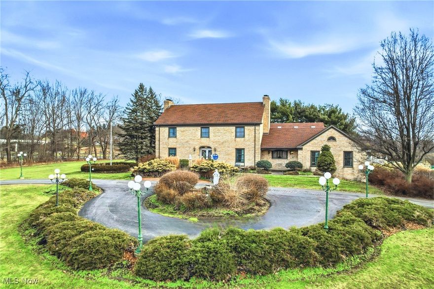 Experience resort-style living with proven income potential—an extraordinary 6-bedroom, 5-bath estate on 5.9+ acres with a private pond in the heart of Canfield. Successfully operating as a short-term rental for 3 years with outstanding 5-star guest reviews, this property offers rare versatility as either a high-performing investment or an unforgettable private residence.
The showpiece is the approx. 4,000 sq. ft. climate-controlled indoor entertainment pavilion designed for year-round enjoyment—featuring a 20’ x 40’ heated indoor pool, expansive lounge areas, and a bar for effortless hosting in every season. For true four-season comfort and reliability, the pool building includes a separate HVAC system with dedicated dehumidification, plus a newly installed roof and skylights.
The main residence blends refined style with flexible living. The first floor features granite finishes, a formal living room, and a chef’s kitchen with high-end appliances and an eat-in area with views into the pool pavilion—plus a formal dining room. Also on the main level: a spacious first-floor suite with kitchenette (ideal for guests or multi-generational living), one full and one half bath, and three additional flexible rooms perfect for guest suites, offices, or hobbies.
Upstairs offers three additional bedrooms, a full bath, and an impressive private primary suite with ensuite bath featuring marble finishes and balcony access overlooking the atrium and pool—your own serene retreat.
The lower level expands the entertaining possibilities with a wet bar, home theater area, generous storage, and a bonus flex room—plus direct access to the attached three-car garage.
Outdoors, enjoy resort amenities including a lighted pickleball/tennis court, expansive patios, a three-car detached garage, and a well-built barn ideal for storage, recreation, or customization. Located in the Canfield Local School District, minutes to parks, golf, shopping, and everyday conveniences.