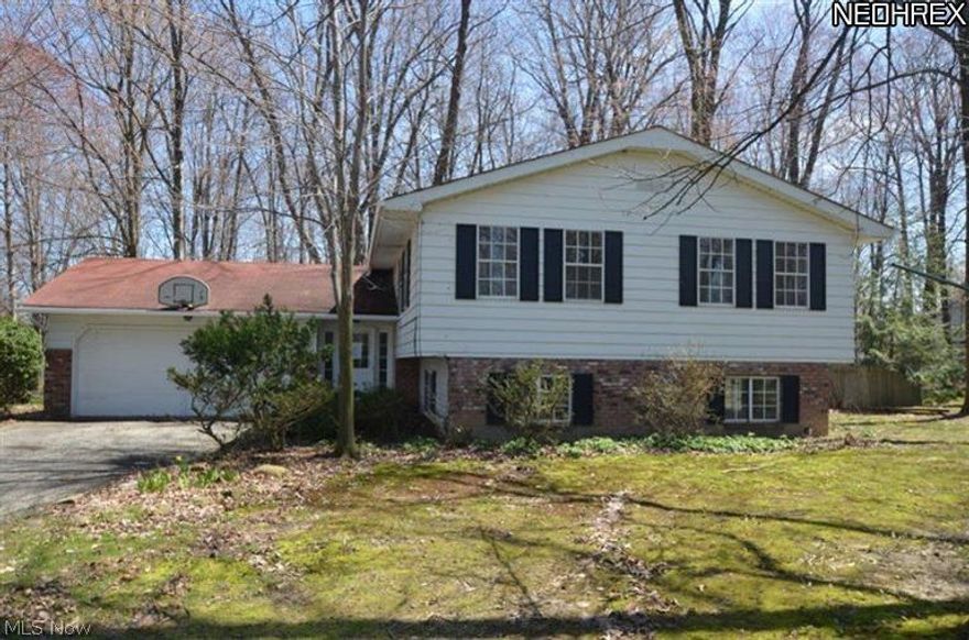 This 3 bedroom, 2 bath split level home features two bedrooms and a full bath on the upper level, a spacious eat-in kitchen and sliding glass doors leading to the large tiered back deck overlooking the wooded lot. The home has been recently renovated including new flooring, fresh paint, dishwasher, range and more. The lower level features a large open family room with fireplace, laundry room, additional bedroom, full bath with stand-up shower and direct access to the 2 car attached garage. Seller is offering a home warranty credit up to $500 and the buyer may use the warranty company of their choice.