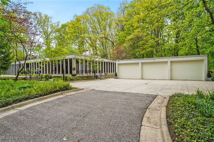Step into timeless elegance with this stunning mid-century modern home. Built-in 1968 and designed by Harvey Stubsjoen—a renowned architect and former Mies van der Rohe student—this home is a true architectural gem. Nestled on a gorgeous wooded lot with lush, forest-like views, it was thoughtfully crafted to blend indoor comfort with outdoor beauty.

Floor-to-ceiling windows flood the interior with natural light, while a central atrium serves as a striking and unique focal point of the home. The nearly 6,000-square-foot ranch features a mirror-image design that makes everyday living both stylish and seamless.

Offering five spacious bedrooms and three full baths, the home is outfitted with well-appointed wardrobes that enhance each room’s sophisticated charm. The minimalist kitchen and living areas strike the perfect balance between architectural beauty and modern functionality.

This house is truly spectacular—don’t miss out!