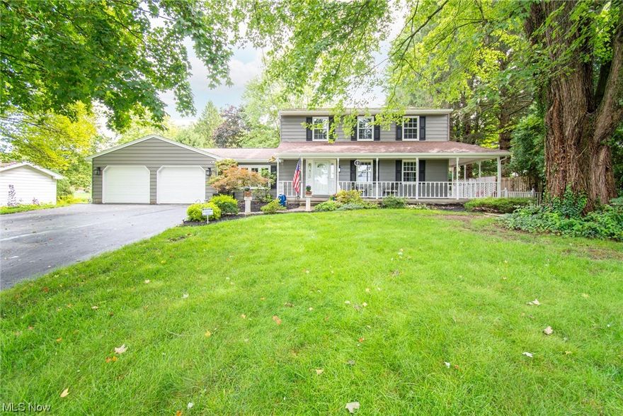 Are you looking for a private paradise that's only three minutes from downtown Poland? You've found it in this one-of-a-kind home with 4 bedrooms, 4 bathrooms (2 full, 2 half), a roomy 2 car garage and a partially finished basement on almost an acre of land! Cross the wrap around front porch and enter the ceramic tiled foyer to see all the possibilities that this home offers. The first floor features three separate living spaces along with a dining area and half bath. The updated kitchen (2020) features quartz countertops, recessed lighting, Carrara marble backsplash and new appliances along with luxury vinyl floors that continue throughout the first level. Upstairs you'll find the primary bedroom with two huge closets and a renovated en-suite bathroom. Three more bedrooms and another freshly updated bathroom complete the second floor. The partially finished basement allows for entertaining, storage, laundry area and a half bath. Prepare to be blown away when you step out the sliding g