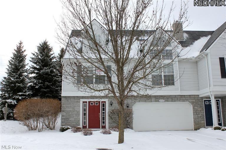 This charming end unit townhouse showcases many wonderful features & upgrades throughout! Vaulted great room w/ cozy fireplace opens to the dining room. The kitchen features granite counters, Pegasus sink, dinette area & appliances are included! The split bedroom design features the master bedroom on main floor & bedroom #2 on the top level offering ultimate privacy. Spacious 20x15 loft w/ ceramic tile overlooks the bright great room. Huge wood deck w/ mature pine trees surrounding the property. Plenty of storage space throughout including a storage closet in foyer, pantry in kitchen, impressive custom built-ins in master bedroom, XL 2 car attached garage & 11x11 finished room in lower level. All new carpet in 2013 and nicely updated bathrooms w/ ceramic & granite. This community is located in South Parma with sidewalks, near parks, shopping & restaurants. Move in ready!
