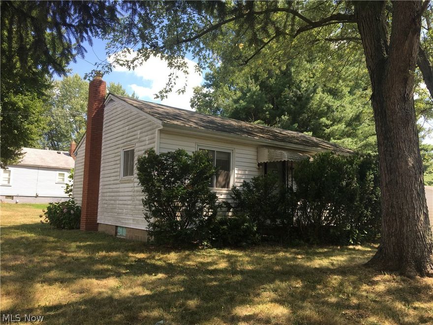 FANTASTIC buy in Springfield Township!!! This home is nestled on a large pretty corner lot and has a huge 2 car detached garage with electric!!! Property also has a large deck off the side of the home that leads into the kitchen which boasts updated cabinets and granite counters!!! Rounding out the main floor is a quaint but desirable floor plan; there's a large living room, full bathroom, and two nicely sized bedrooms. Home has a full basement; could possibly be finished to add a TON of additional living space!!! Overall this property looks to have a lot of updates within the last ten(ish) years - there's LOADS of potential here!!! Realize the value and move fast - this property DEFINITELY will not last!!!