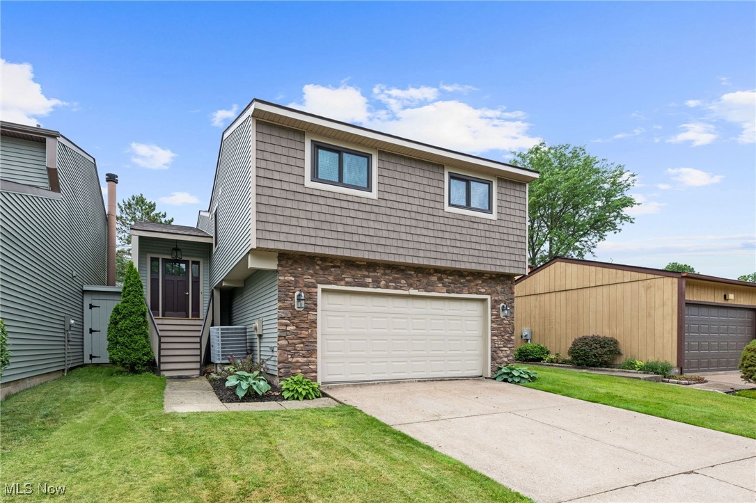 Missing a One-of-a-Kind, truly unique property is not on anyone's to do list, so, make sure to make the time to privately tour 7152 Rippling Brook Ln in Concord before it is claimed by someone else! This lovely townhouse has been renovated spectacularly from exterior to interior, move in ready for your enjoyment for years to come. Let's start from the top, in 2022, the roof was replaced as well as the exterior shake and stone was added to give this home amazing curb appeal. Walk up the inviting entry staircase to the stunning open foyer. The upper, main level of the home features an open floor plan from the updated kitchen with Quartz countertops and new stainless appliances, to the dining and living room areas. After a long, hard day, step into your owners' bath that feels more like a spa and relax in the large soaker tub. Also featured, a large tile shower, double vanity and walk-in closet. A second bedroom, 2nd full bath and spacious laundry room round out the upper main level. Going downstairs, enjoy another living room with a large slider to let the gorgeous sunshine flow into the space. Sit out on the back patio, or in the huge, enclosed Florida room, whichever feels more enjoyable at the moment. The 3rd bedroom and full bath are also in the lower level, with access to the attached garage. A really remarkable property that you will love to call your new home!