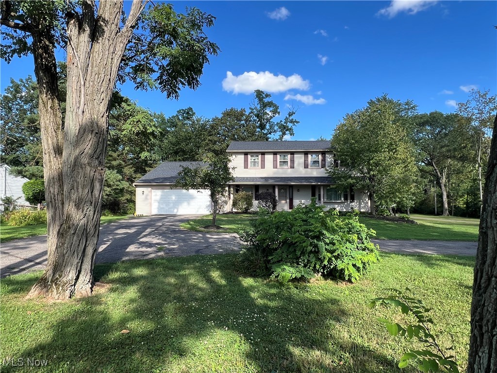 NEW PRICE & A BRAND NEW ROOF that was JUST installed on 8/22/25!! Enjoy a small-town, rural lifestyle in picturesque Hinckley Twp, while being just minutes to shopping, dining, and the highway! Distinctive 2-story with main-level Primary Suite, full bath, and Laundry/Mud Room with cubbies. Oversized kitchen with island, dining area, abundant cabinets, and stainless-steel appliances opens to vaulted Family Room with wood-burning fireplace and built-ins. Upstairs: 4 bedrooms, with one featuring a private en suite bathroom. Finished lower level with Recreation Room, flex/office space, storage/workshop, and garage access. Pet-friendly features include an invisible fence and indoor pet-wash. Stamped-concrete patio, large parklike backyard, and RV/boat parking. No HOA. County square footage excludes rear addition.