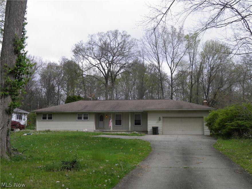 This Poland Ranch has so much to offer! Set back off the road, the home is nestled on a little over an acre of property that is partially wooded. Walking in the front foyer, this home has updated laminate flooring and a nice sized living room. Formal dining room. Neat and tidy eat in kitchen is equipped with all appliances. First floor Laundry. Half guest bath. Open Family Room with doors that lead to the awesome deck overlooking the backyard. The master bedroom suite has a walk in closet and a great master bath along with doors that lead to its own deck. The two guest beds are both spacious and have excellent closet space. Full guest bath is roomy! The full basement has an enormous rec room, utility room, a workshop and the way the basement is set up is efficient. Two car attached garage with auto door opener. Well kept exterior! What a gorgeous setting. The backyard is defintely one that can be enjoyed and the potential to add your own touches to it is there! Call today, a ranch with