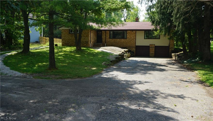 Large Ranch on just over a one acre lot located in North Royalton! Home has side by side additional living suite with bedroom, kitchen, bathroom, and living room! Great opportunity for rent, or even redesign to open up for a larger living area! Vinyl windows throughout, second gravel driveway that loops around the home for a private entrance for the additional living suite. Roof was installed new in 2017 and home comes with a 1yr home warranty!