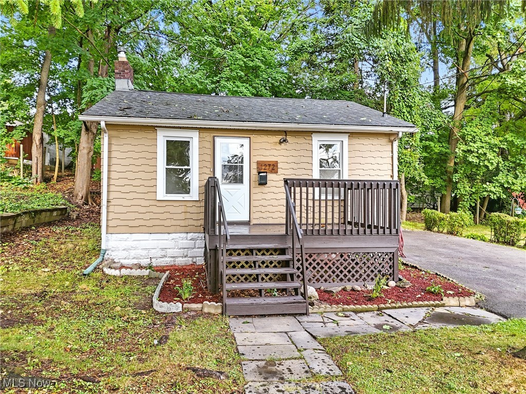 If you are looking for the cutest, cozy cottage ranch on a peaceful street in Akron, you've found it right here! All the work has been done for you - just move right in! Drive up the nicely paved driveway and you will be greeted by the large front porch, where you can relax and enjoy the large, private front yard. Travel inside and you will find everything has been freshly painted and updated. New LVT flooring has been installed in the living and dining rooms. And, new carpet has been laid in the bedrooms and hallway. Try out new recipes in the kitchen equipped with a gas range and dishwasher. Adjacent to the kitchen, you will find a large closet/pantry, a full bathroom with a HUGE linen closet, and a stairway to the full, unfinished basement, which may be used for additional living or storage space. This home offers convenient access to Route 8, the Innerbelt, the University of Akron, Stark State College/Akron, Chapel Hill, Cuyahoga Falls, downtown Akron, and local hospitals. Roof and windows are less than 10 years old. Updated furnace and electrical. Come and tour today!
