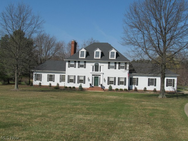 Custom built Zampelli home on 4 beautifully landscaped acres. This magnificent home features 5 bedrooms, 4.5 baths with a master suite that has a marble gas log fireplace. The large gourmet kitchen features cherry cabinets with 2 pantries and a center island. The home also has a finished basement, heated garage and a back up power system. At the rear of the property is a 48 x 24 heated 4 car carriage house with a finished upper level. This home is a must see with many extras.