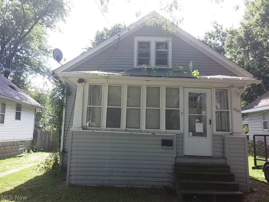 Bungalow home with an enclosed porch, vinyl siding, and a detached garage.  Also features a partially fenced in back yard.  Great opportunity!  Stop by today.