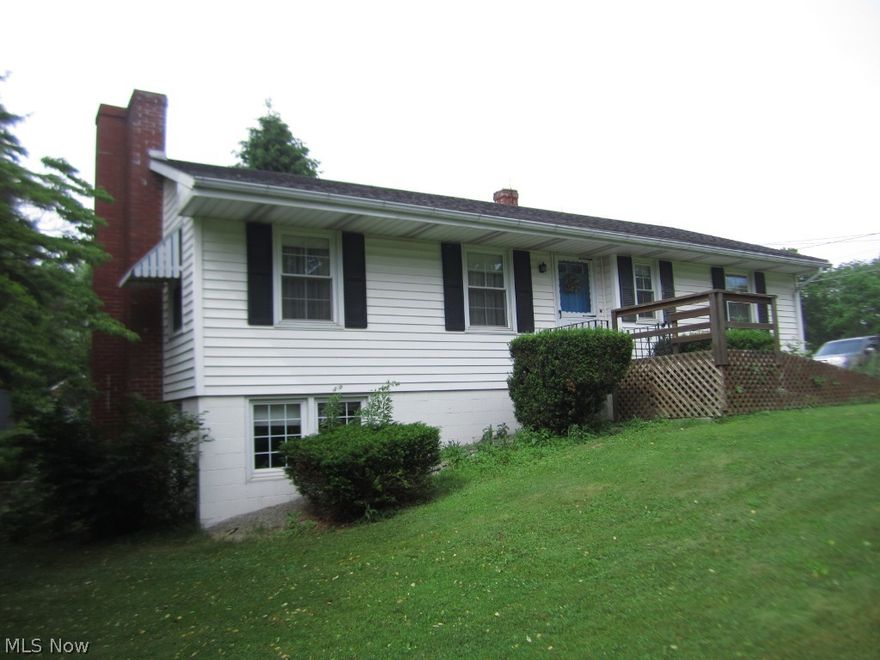 Ranch on 4/10 acre in city. 2 bedrooms, 2 baths and finished walkout lower level. Owner's believe there are hardwood floors under carpet. Rec room has wood stove for extra heat. Replacement windows, vinyl sided, covered patio. Two (2) one car garages, one used as a shop. Close to schools. Excellent Value.