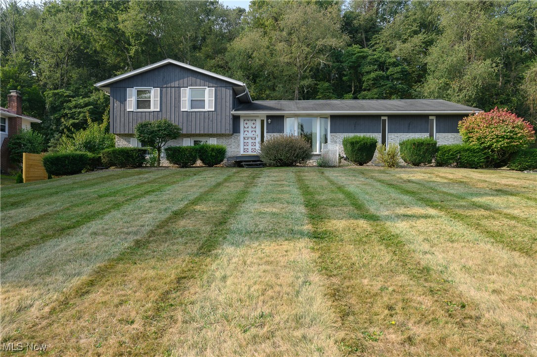 Welcome to 10778 Yare Cir., a charming 3-bedroom, 2-bath home offering 1,560 sq. ft. of comfortable living space on a peaceful .69-acre lot. Tucked away on a quiet dead-end street within the highly desirable Northwest Local School District, this home has been lovingly maintained and is ready for its next owner. The inviting main level features a spacious living room with a cozy fireplace and a sliding glass door leading to a concrete patio, perfect for outdoor relaxation and gatherings. The kitchen and dining areas provide functionality and flow, making mealtime and entertaining a breeze. The lower level is a true highlight with a stylish bar setup—an ideal space for hosting friends and family. With its versatile layout, this home offers both comfort and opportunity to make it your own. Outside, enjoy the privacy of nearly three-quarters of an acre, giving you plenty of room to spread out while still being close to all the conveniences Canal Fulton has to offer. Don’t miss your chance to own this well-cared-for home in a sought-after neighborhood. Schedule your showing today!