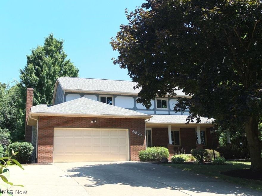 Gorgeous remodel with spacious living areas, finished lower level, private backyard and updated bathrooms! Sizeable great room is open to the formal dining room with chair rail - both with crown molding. Family room has a brick fireplace and bay window. Kitchen has stainless steel appliances, pantry, built-in desk, tile flooring and backsplash and a considerable dinette with slider to back patio. Half bath with solid surface countertop and laundry room on the main level is very convenient. Master suite has double closets and a private full bath with a skylight, dual sink vanity and vessel sinks. There are 3 additional bedrooms with large closets and a completely updated full bath with skylight. Finished lower level has a rec room with a bar and a bonus room that would make a fantastic play room or hobby room! Oversized 2-car attached garage boasts a workbench and ample storage. Many updates including new A/C in 2016, new hot water tank in 2016, all new carpet, updated bathrooms with ne