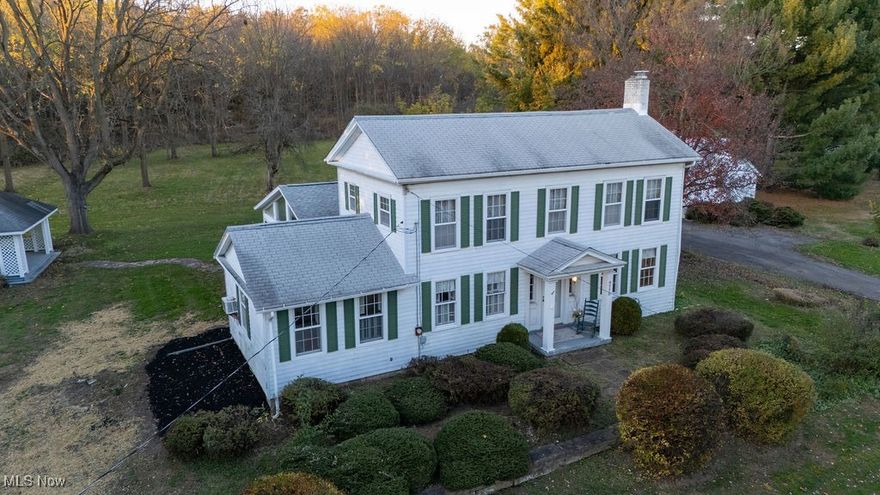 From the moment you arrive, the home’s character and peaceful setting stand out. This charming 1925 Colonial offers 4 bedrooms and 2 full baths and sits on 1.63 scenic acres in a highly desirable Seville location, providing space, privacy, and endless potential to make it your own.
Step inside to the heart of the home, where the spacious family room offers a warm gathering space with a cozy fireplace and custom built-ins, along with direct access to the stunning sunroom. Filled with panoramic views of the property, the sunroom is the perfect place to relax or entertain year-round. The eat-in kitchen features a functional layout with a breakfast bar and convenient access to the main-floor laundry room. A separate mudroom adds valuable everyday functionality.
The dining room is accented with custom built-ins and classic shutter window treatments, bringing both charm and practicality to the main floor. The formal living room features the home’s second fireplace, elegant shutter window treatments, and French doors that enhance its character. The main-floor bedroom offers two closets and shutter windows—ideal for guests, multigenerational needs, or a private home office. Throughout the main level, you’ll find gorgeous wood moldings that highlight the home’s historic charm.
Upstairs, three additional bedrooms and a full bath offer plenty of space for everyone. Outside, the expansive property features mature trees, open green space, and a charming gazebo perfect for outdoor entertaining or quiet evenings.
Additional highlights include a large, partially finished basement, multiple indoor–outdoor access points, and ample storage. Located near local parks and offering quick highway access, this home blends historic character, usable land, and a prime Seville location—ready for your personal touch.
Listing agent, Brittany Balmat, is related to the sellers.