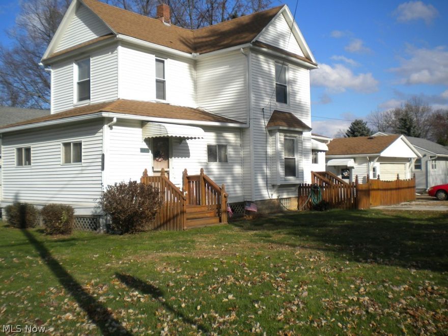 A Fantastic buy for someone willing to do the painting and cosmetics...vinyl siding and replacement windows, wonderful 2+ car garage, extremely large first floor bathroom, enclosed porches,an outside concrete patio with fenced side yard for doggy .   great corner lot with easy access from e Huston st..sold  "as Is"