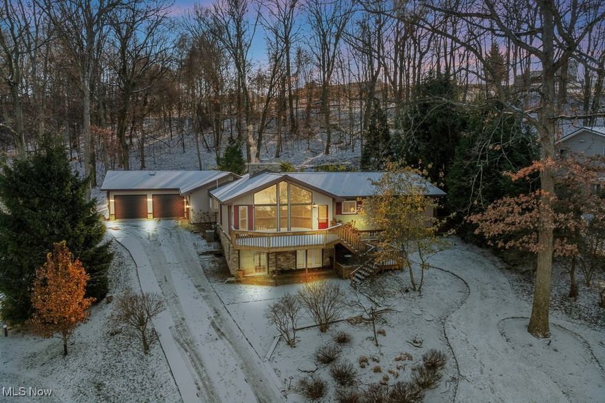 Welcome home to this custom-built lake-view home in the desirable gated community of Lake Mohawk! The lake lifestyle is calling to you with this home's wonderful mix of contemporary upgrades, serene privacy, huge garage spaces, a breathtaking view of the lake, and a finished walkout basement! The extra-large family room features hardwood floors, beamed vaulted ceilings, a gas fireplace, and killer views of the lake. Make your way into the eat-in kitchen, which is a chef's dream. Featuring custom-built soft-close cabinetry, granite countertops, custom backsplash, beamed vaulted ceilings, a convenient island, dedicated dining space, and a huge walk-in pantry. Down the hall, you'll find the wonderful full bathroom, recently updated, as well as the four large bedrooms, each with LVP flooring and large closets, and the wonderful master suite! The master bedroom is the largest, and features two closets and a full bathroom. Downstairs, the huge, finished, walk-out basement is the perfect compliment to the main floor. Featuring a recreation room, full bathroom, laundry room, multiple bonus rooms/office spaces/bedrooms, all with new flooring! Take the party outside, where you will enjoy entertaining in the super-private backyard area, featuring a Trex deck, patio, and above-ground pool. Like garages? This home features a heated attached 2+ car garage, as well as another heated attached 1200+ square foot, 6 car garage! Finally, the lakeview from the front deck is unbeatable, truly one of a kind. Lake Mohawk is a private gated community with an unlimited horsepower 500-acre lake, 3 beaches, an executive 9-hole golf course with a separate membership, tennis/pickleball courts, clubhouse, and more! Call today for your private showing in order to make this home yours!