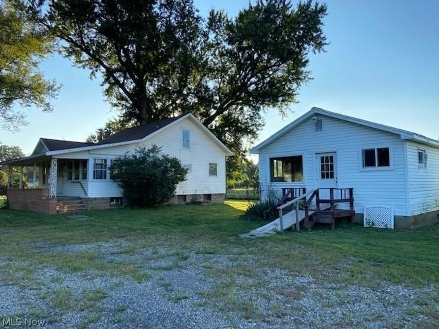 Opportunity knocks.  Convenient location to owner occupy or investment property.  Main house has 2 bd up, 2 bd first floor.  Sun room on the front.  Laminate flooring with some carpet.  First floor bath.  Home needs some renovation, but is good and solid.  Updated roof, vinyl siding.  Potential here for a nice investment property.  Small white house on the property has one bedroom, living room and open kitchen concept.  This unit could be rented out fairly quickly--needs very little work.  One-car garage. New propane tank set in July 2022.  Lot goes to the neighboring driveway to the left of the main house.  Nice level lot.  Property may require flood insurance.  Don't miss this opportunity.  Take a look.  If you are handy with repairs, this one is for you.  Seller has never lived on the property.  It has been rented since 2012.