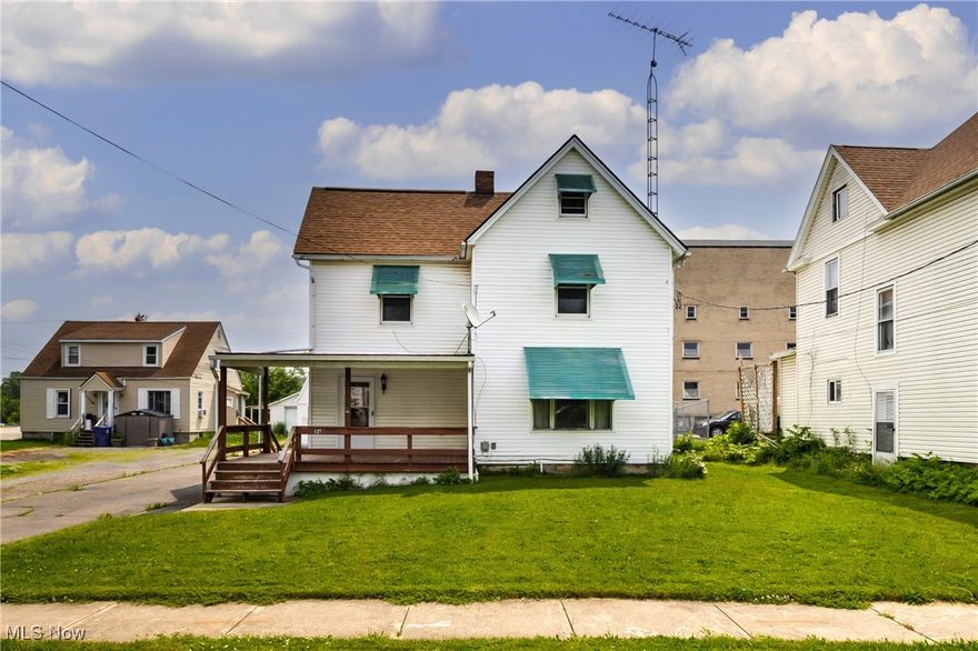 Welcome to this beautifully updated home located on a quiet street while still offering easy access to local amenities and main roads. The large covered front porch adds charm and provides the perfect spot to relax.  Inside, you'll find fresh paint and new flooring throughout, creating a clean and modern feel from the moment you step in. The spacious first floor layout includes a full bathroom and offers plenty of room for comfortable living or entertaining.  Upstairs, the generously sized bedrooms provide flexibility and comfort, while the primary bedroom boasts a large walk-in closet for all your storage needs. Out back, the fenced-in area offers versatility for pets, gardening, or simply enjoying your private outdoor space. The garage is a true standout feature with ample room to park, an area that can be utilized as a workshop, second floor storage, and hookups in place for an air compressor, perfect for hobbyists or anyone who needs extra space. If you're looking for a move-in ready home with space, updates, and functionality both inside and out, this one is a must-see.