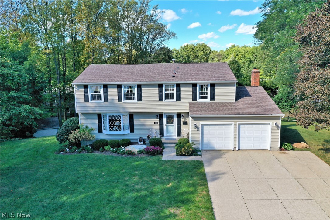 Fantastic 4 bedroom, 2 1/2 bath colonial is so well maintained, quality, super clean, warm and inviting. Enter the home and enjoy the nice living room with bay window and dining room combination. Beautiful eat in kitchen features plenty of custom made Schrock cabinets, granite counters, nice appliances, superb view from the kitchen window and slider to the deck AND is open to the family room, which features a gas fireplace to keep you warm this Fall and winter. There is also a french door to the deck. A powder room completes the first floor. The second floor features the primary ensuite with full bath/walk-in shower and large walk in closet. The other 3 bedrooms are a great size and offer good closet space. An updated full bath is a bonus. Solid wood 6 panel doors throughout. The outdoor space is so lovely featuring a 2 tier deck - perfect for entertaining, power awning to shade you on those hot, sunny days and beautiful brick patio with a firepit and seating wall to enjoy th