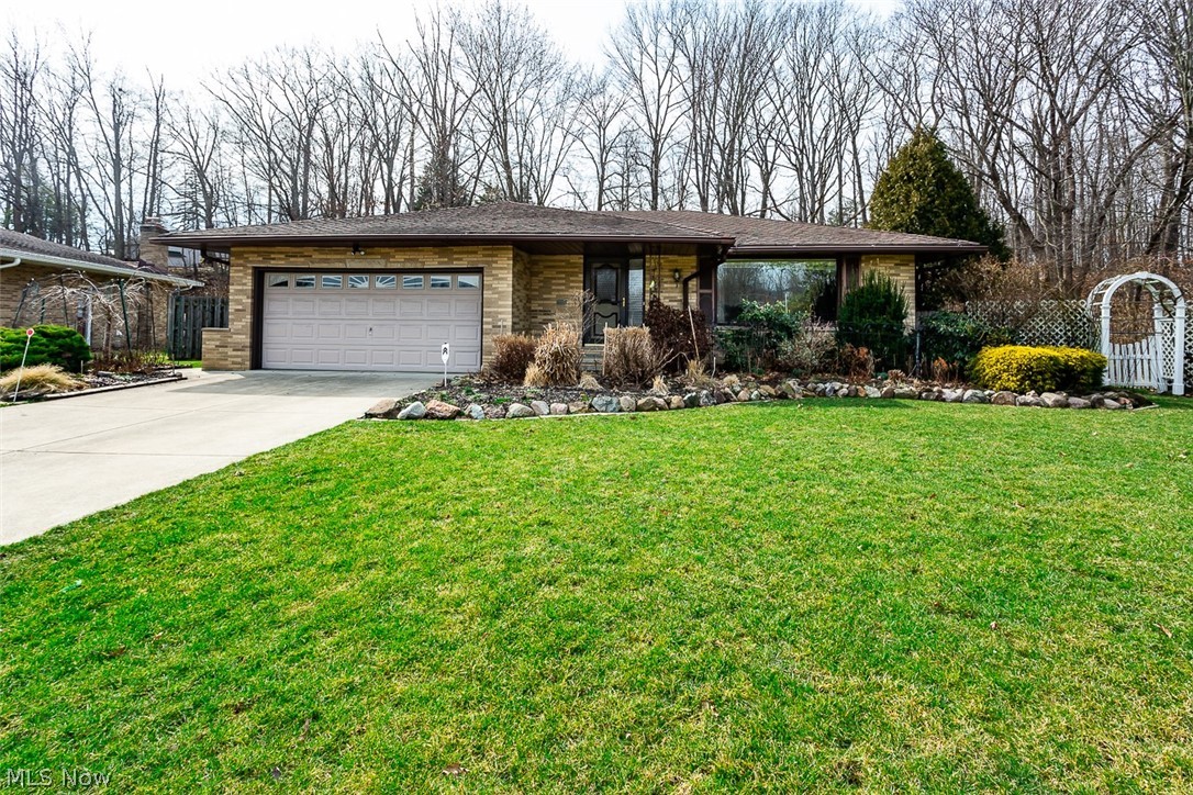 This well maintained 3 bedroom, 2.5 bathroom ranch home is ready for your personal touch! Stepping in to the welcoming foyer you are greeted by the abundance of natural light provided by the large picture windows in the spacious living room! The generously sized, eat-in kitchen spills in to the family room with a wonderful built in entertainment center with fireplace, Anderson patio doors that look out on the wooded back yard and a half bath that leads to the Master Bedroom! Heading back through the kitchen leads you down the hallway to three bedrooms with maple hardwood flooring and neutral colors that are accompanied by a full bathroom! The master bedroom also boasts entry to the half bath connected to the Family Room! The full, finished basement is the perfect setting for entertainment with a built-in bar area, a full bath just off of the laundry/utility room that has a new Bryant HVAC system and a large bonus room! Just outside of the family room Anderson doors, the patio area and