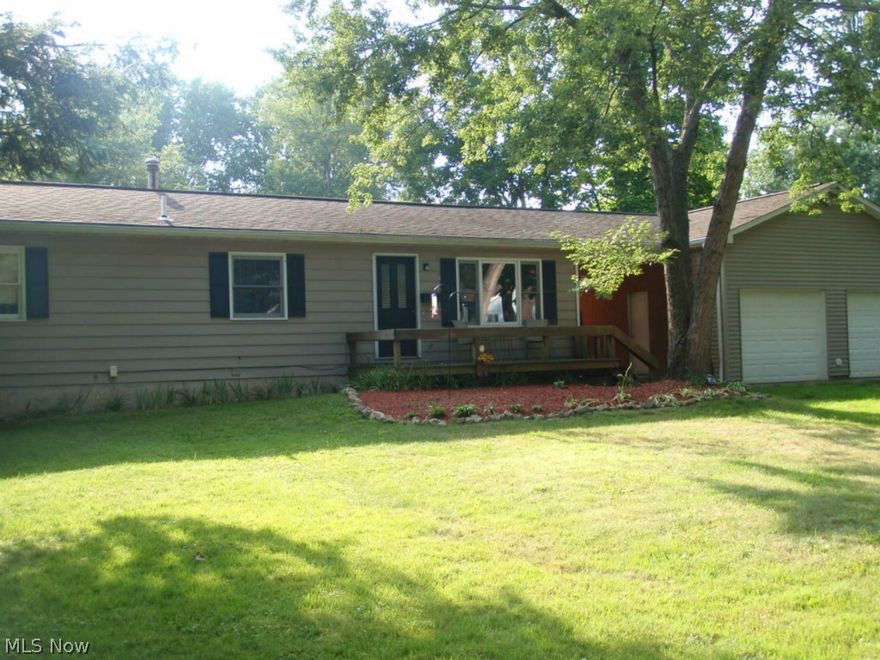 Cozy 4 Bedroom Ranch, Quiet Setting!  Updated with New Wood Floors in the Living Room & Hall, Vinyl in Kitchen & Carpets; all walls newly painted & new light fixtures in 2012.  Stainless Appliances stay!  Full partially finished Basement has Full Bath & Bar w/sink!  Deck & Breezeway lead to enormous 4 Car Garage w/electric and gas - great for Mechanic, Carpenter, Hobbyist, Painter!!