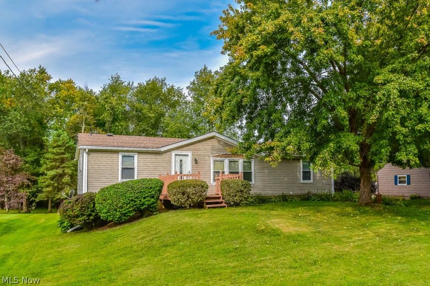 Beautiful 3 bedroom, 2 full bath ranch on a large lot! Open great room, dining room and kitchen with vaulted ceilings. Prepare your favorite dishes in the updated kitchen with ceramic tile flooring, fantastic counter space, a pantry, tile backsplash and a breakfast bar. Wonderful space to entertain guests or for keeping an eye on the kids during meal prep! First floor laundry room, too - a real bonus! Split bedroom design allows for a peaceful master suite with vaulted ceilings, a walk-in closet, a private full bath and dual sinks. The main full bath has a vaulted ceiling, tile flooring and shower surround. 2-car rear load garage with access to the partially finished lower level containing tons of potential! The basement has been roughed out with a kitchen, bedroom, living room and plumbed for a full bath. It has its own entrance to the backyard and to the garage. It would be perfect for an in-law suite or for a guest area! Entertain on the large 16x13 deck overlooking the backyard wit