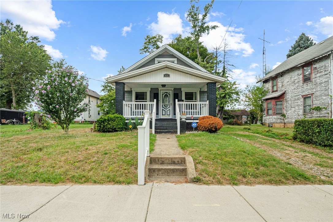 Welcome to this charming and well-maintained 2-bedroom home featuring 1 1/2 baths, ideal for comfortable everyday living and sweet curb appeal. You will appreciate all of the updates throughout, including a newer roof less than 3 year old, furnace and central air system replaced in 2015, and updated electric. In addition the windows, hot water heater and vinyl siding were all updated in the last 5 years! Step inside to find new flooring throughout, and an updated galley-style kitchen complete with a decorative tile backsplash, stove, and refrigerator. Additional highlights include a new front door, glass block basement windows, and a spacious 2-car detached garage. A handicap-accessible ramp is also in place and can stay if needed. Blending practicality with value, this home is move-in ready and waiting for you!