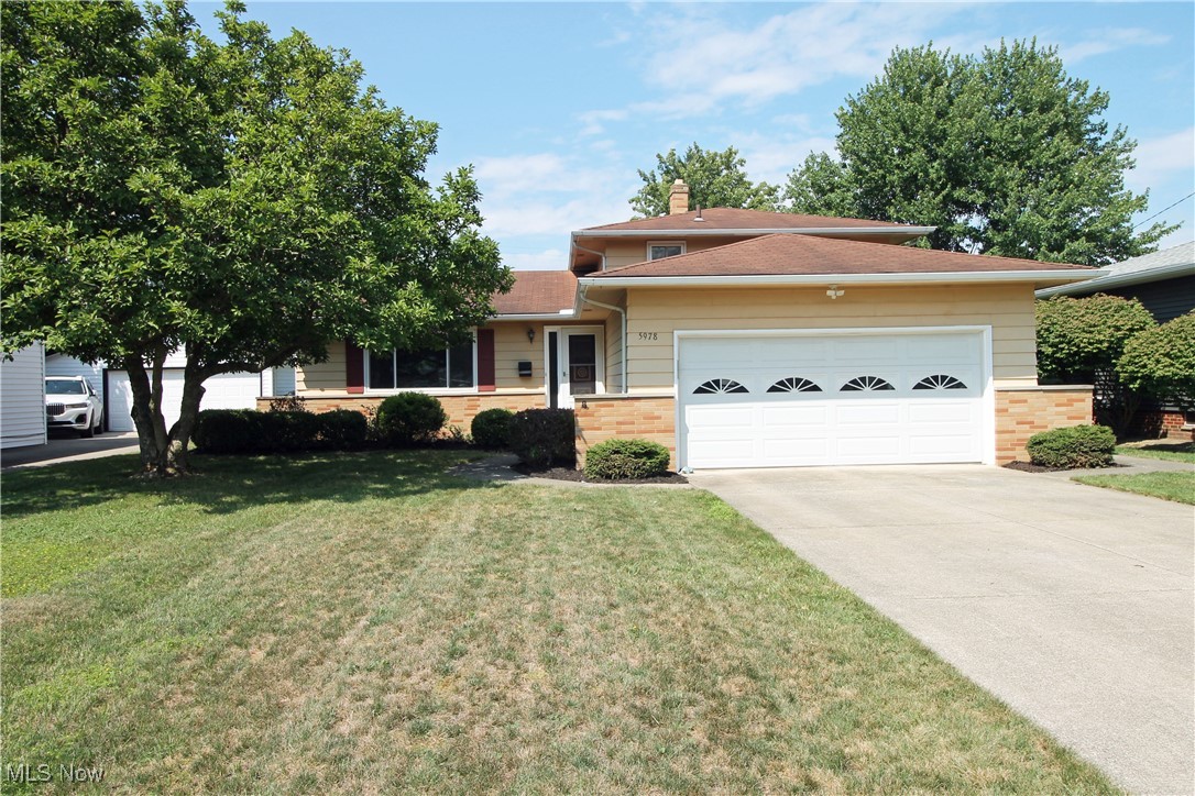 Beautiful 4-Level Split in Bedford Heights…Move-In Ready! Welcome to this beautifully well maintained & updated 4-level split located in desirable Bedford Heights. This spacious home offers comfort, functionality, and charm throughout. Step into the inviting foyer and instantly notice the exceptional care this home has received. The main level features a bright and airy Living Room and Dining Room, both with brand-new carpeting. The Eat-in Kitchen is up-to-date, includes all appliances, and offers ample space for everyday dining. Upstairs, you'll find three comfortable bedrooms with gleaming hardwood floors and a full bathroom. The staircase and hallway also feature brand-new carpeting for a fresh, modern feel. The lower level boasts a large Family Room with direct access to the large 24x10 covered patio, perfect for indoor/outdoor entertaining. This level also includes a half bath, entry to the 2-car garage, and a spacious laundry room with washer, dryer, dual utility sinks, stand-up shower(2nd shower in the home), and a second fridge/freezer all staying with the home. New luxury vinyl tile (LVT) flooring completes this level. The finished basement offers even more living space with a Rec Room, an additional room with a closet (ideal as a guest room or office), and a workshop/storage room. Newer furnace (2023), Windows (2009), Dishwasher (2025), Carpeting (2025), LVT Flooring (2025), Basement floor painted (2024) & home was waterproofed-exterior in (2007). Heated (gas) two-car garage. Fenced-in back yard w/screening for small pets, a spacious 10x14 Shed with an additional 2 1/2 x 7 attached storage area. Outside, enjoy a fully fenced private backyard with screening perfect for small pets, a generous 10x14 shed with an additional 2.5x7 storage area. This is a rare opportunity to own a spacious, well-cared home with so much to offer in a great neighborhood. Home will be offering a clean POS to the buyer. Don’t miss out. Schedule your showing, & Begin Your Story Here!