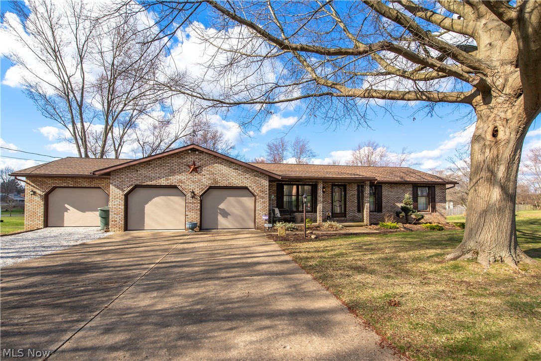 **NEW septic system being installed** Custom built 3 bedroom 1 1/2 bath ranch with 4+ car attached and heated garage. This home is located in a cul-de-sac and has been meticulously maintained. There is large rear deck and walk out basement with work shop. The basement is plumbed for a bathroom. Sits on a .61 acre lot in a nice neighborhood in Lake Township. Family room has a brick hearth with gas fireplace and built in bookcases on both sides. Formal living room and formal dining room, kitchen with eating bar and window overlooking a partially covered large rear deck with stairs to backyard. 1/2 bath off family room and 3 bedrooms in hallway with full bath. Updates include furnace 2019, 2+ heated garage addition 2019 (tandem), concrete in original garage 2015, water softener 2014, well pressure tank 2020 and newer roof. There is a large storage shed under the rear deck. Seller is a licensed real estate agent. You could put a washer and dryer in the heated garage or a stackable could po