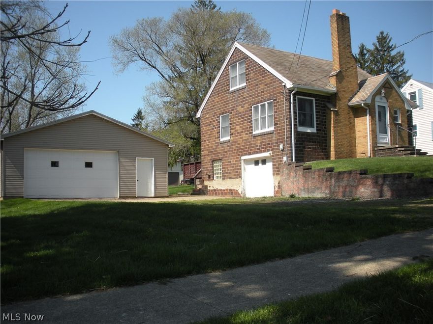 Charming Cape Cod with a lot of character in the heart of Smithville overlooking the park.  This home features a basement one-car garage and a separate 28 x 28 detached two-car garage with a finished 7 x 20 insulated room.  Living room features a gas fireplace and hardwood flooring.  Small office off of the living room has built-ins.  Eat-in kitchen boasts cupboards galore and the appliances stay.  Ample room in the full bath on the main level to add a stackable washer/dryer if desired. The upstairs also features hardwood flooring, 2 bedrooms with adjoining walk-in closet and a half bath.   Washer and dryer in basement also remain with the property.  Enjoy the back deck overlooking the spacious yard.  Schedule your personal tour today and be ready to move in!