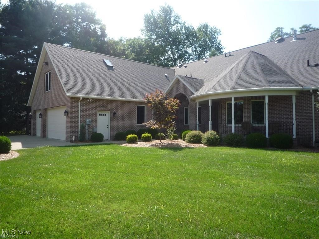 River Road Vienna! This exceptional custom one-owner home, built by Rick Webb, is perfectly situated on a ¾-acre lot overlooking both the golf course and the Ohio River. Drive your golf cart straight to the Country Club! Quality craftsmanship shines throughout this all-brick residence featuring 10' ceilings, solid wood panel doors, and hardwood floors. The open-concept layout includes a gourmet kitchen with maple cabinetry, granite countertops, stainless steel appliances, under-cabinet lighting, a breakfast bar, and an island with prep sink. A spacious walk-in pantry provides abundant storage. The owner's suite measures an impressive 17x23 and offers a vaulted ceiling and patio doors opening to the screened porch. The luxurious en-suite bath includes a large walk-in shower with three spray heads, dual-sink granite vanity, and a dedicated makeup bench. The 10x16 walk-in closet features built-in cabinetry and connects conveniently to the laundry room. Enjoy true one-floor living with numerous high-end amenities: birds-eye maple built-ins in the great room, a 10x70 screened covered porch facing the golf course, a butler’s pantry with wine cooler, custom remote-control blinds, central vacuum, Kinetico water softener with reverse osmosis system, and a 20kW Generac generator. Additional highlights include an outdoor sprinkler system, two water meters, and an oversized 3-car garage (28x33) with a semi-finished caretaker/in-law efficiency suite above. The finished basement adds another 2,000 sq ft, featuring a 19x26 media room, a 23x36 game room, and a full bath. Outdoors, enjoy a dedicated potting room for gardening enthusiasts and a natural gas grill. Included with the home is a ¼ ownership interest in 14.25 acres of riverfront land, offering direct access to the Ohio River. Total finished living space: 4,956 sq ft (per auditor). All room measurements are approximate.