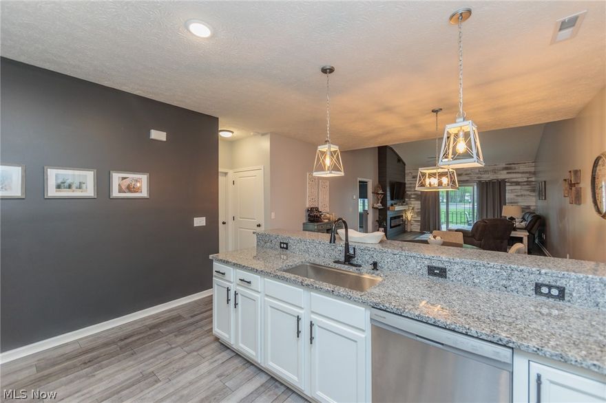 Move right in to this adorable home with loads of extras!! Stylish flooring, lighting and paint colors throughout w/updated modern flair in this open floor plan including 2 beds and 2 full bath!! The updated kitchen features freshly painted cabinets, granite countertops, farm style sink and newer stainless appliances!! A tile back splash an stone feature on the bar area are a few of the extras that make this home special!! The family room features a built in electric fireplace and leads to an oversized 14x14 concrete patio! The owner's suite features an updated bath with walk in shower and marble vanity! The 2nd bedroom is large and is adjacent to another full bath with tub! The laundry room includes washer/dryer and loads of storage!! The 2 car garage has additional attic storage with pull down steps!! Great location near shopping and amenities! Make your appointment today!