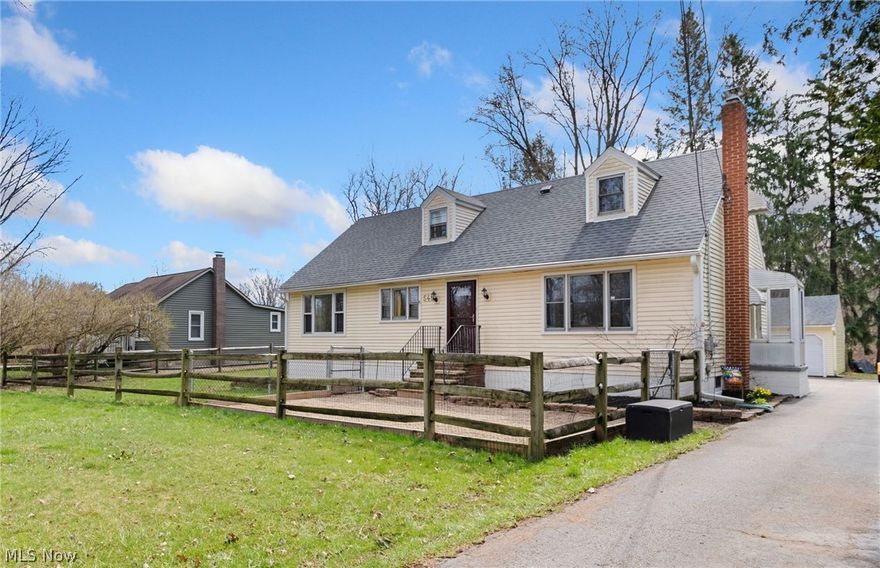 Welcome to this spacious Cape Cod located on over .67 acres property in Macedonia with convenient location near I-271, Rt 8, I-80, Cuyahoga Valley National Park, many restaurants, shopping, Recreation Center and many other local attractions. This home features 2 full bathrooms, a first floor primary bedroom with a walk-in closet, a first floor laundry room, and a finished basement with a kitchenette. Since purchasing the home, the owners have completed the following UPDATES: replaced the house roof and garage siding and roof (2020), hot water tank (2021), finished second level attic area space into a bedroom, professionally installed gravel pad, added a greenhouse, gazebo on concrete pad, added a front gravel patio with a fence and gate, replaced basement windows, added smart thermostat and switches throughout the home, installed professional whole home network (2022) and so much more.  INCLUDED are ALL kitchen appliances, washer/dryer, gazebo, greenhouse, and 1 year home warranty.