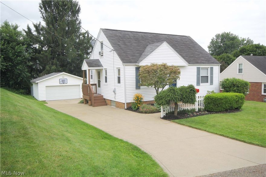 Move in ready! Wonderfully updated home in a desirable NW Perry neighborhood. Don't miss this adorable 3 Bedroom, 2 Full Bath bungalow with a walk out lower level from the french doors of the recreation room. The welcoming improvements are newer roof, siding, windows, furnace, air and more. The interior's modern decor features new paint, carpeting, dishwasher, and refrigerator. There is an oversized 2 car garage with electric and built in storage.
The lovely landscaped lot includes a fenced in rear yard. Call today for an appointment to see !