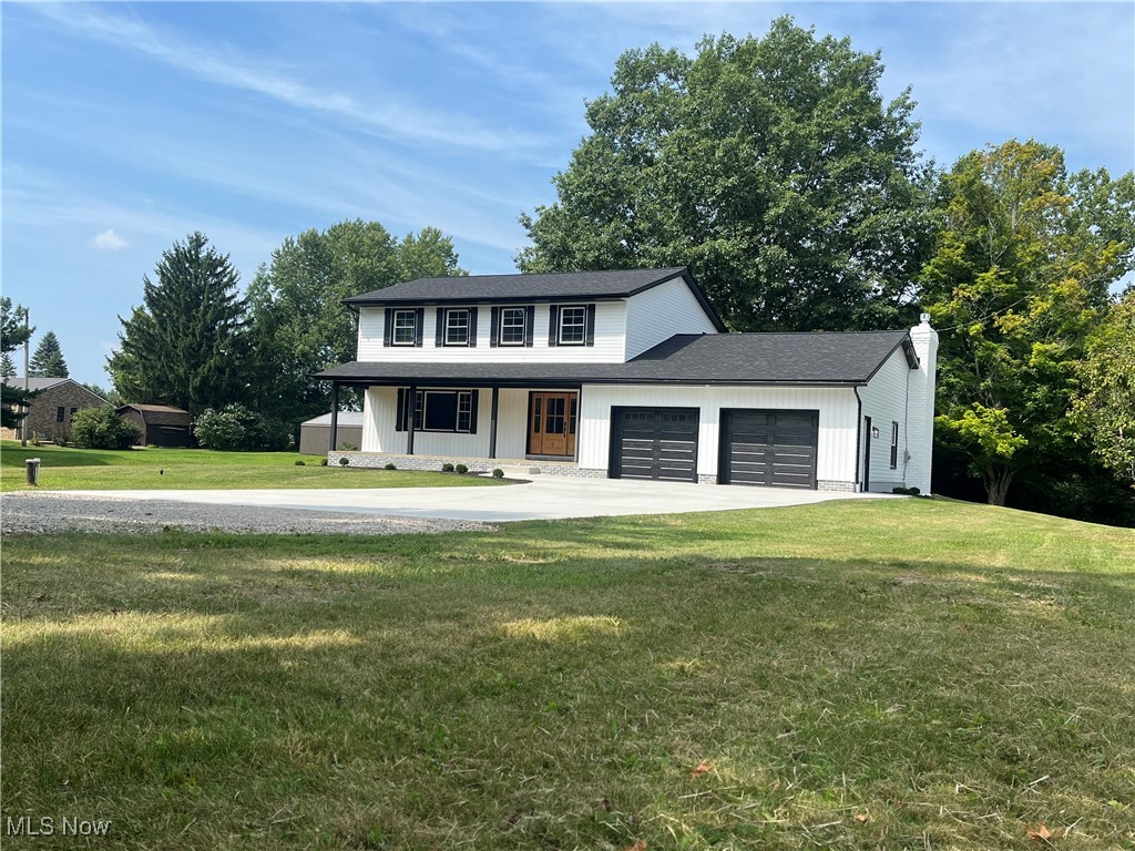 This home has undergone a meticulous renovation, leaving no detail overlooked & no expense spared. Exterior features a new roof, siding, gutters, & downspouts, along w/new septic system, well, driveway, & stamped patio. All new windows including basement glass block, new exterior doors, garage doors w/belt-driven WiFi openers, & exterior lighting have been installed. Beautifully designed front patio showcasing a natural knotty alder wood entry door w/matching ceiling & recessed lighting. Interior has been completely transformed w/open spacious floor plan. First floor boasts new luxury vinyl plank flooring, new casing & baseboard trim, updated electrical, & all new lighting. Custom-designed kitchen is a standout feature, offering Schrock cabinetry, quartz countertops, & new appliances. Formal dining room w/custom-designed accent wall. Two living areas, featuring cedar accent wall, custom gas fireplace w/ added heat & remote controlled. New Anderson French doors open directly to the stamped patio & 2+ acre wooded backyard. All bathrooms have been completely renovated, w/new plumbing, electrical, lighting, toilets, & vanities, as well as custom-tiled showers & oversized soaking tub. Additional updates include custom stair railings designed to match the home’s décor, matte black solid-core interior doors, all-new carpet throughout, & updated electrical systems, lighting, & ceiling fans. Attic insulation has been upgraded to meet modern standards. 11-course basement is clean, dry, & ready for whatever you envision, w/an updated electrical panel, new gas hot water tank, water pressure tank, & new water softener. Home is equipped w/smart home technology, including Google thermostat, doorbell, & spotlight w/camera overlooking the backyard. The property sits on 2.02 acres of cleared land, w/an additional 2.43 acres of wooded land in the back. A new home without the wait to build, all on over 4 acres of beautiful land. Truly a one-of-a-kind property.