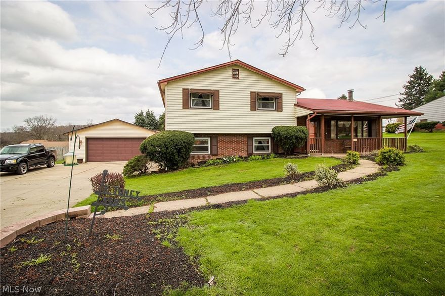 Nicely updated 4 level split on almost half an acre!  This floor plan offers so much space and includes a private in law suite!  Enter into the living room with gas fireplace. The kitchen has stainless appliances, glass tile back splash, ample cabinet and counter space and room for a dining table.  French doors lead to a bar just off of the family room.  The family room has floor to ceiling windows, a corner fireplace and French doors that lead to the deck. A full bath is conveniently located on the main level as well.  Up a few steps you'll find the master bedroom plus two additional bedrooms that share an updated full bath.  The walk out lower level is a perfect in law suite!  A private entrance leads you into a living room with dining area and gas fireplace and is open to the kitchen.  A bedroom with large closet and full bath round out this level.  Down a few step you'll find a bonus room which is currently being used as the 5th bedroom.  Outside, this home has great curb appeal an