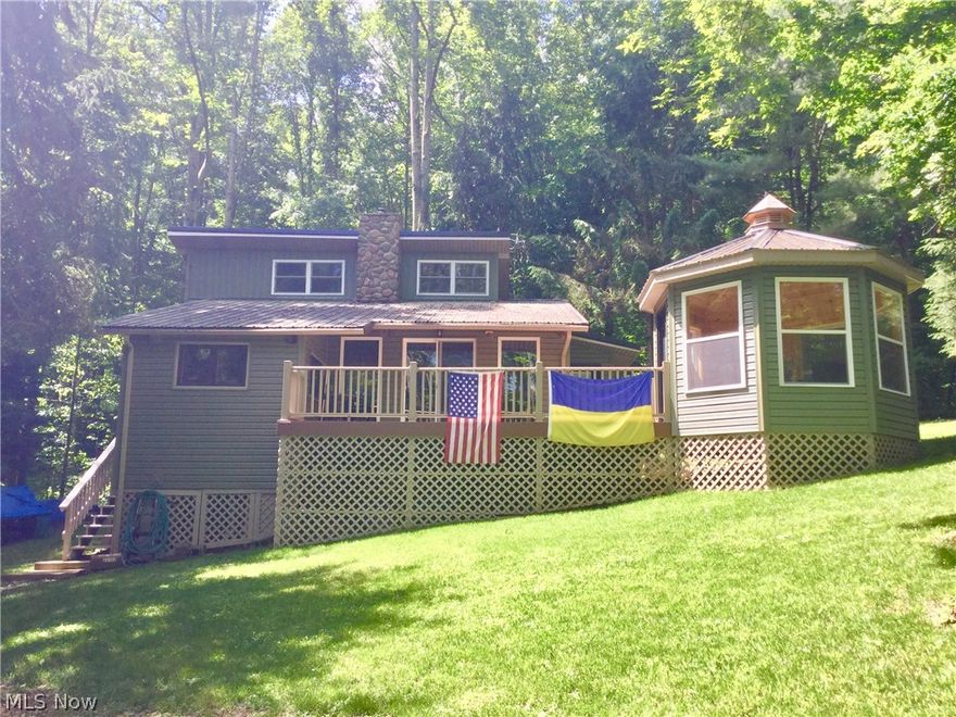 This well maintained and remodeled cabin,is a great get-away on beautiful Piedmont Lake. (Lot#P-320) With a lake view, it offers a front deck with and extended enclosed gazebo room attached; use it for relaxing on cool days or evan a kid's camp-out. This 1.5 story, 2 bed and 1 bath cabin is approx. 1230sf with lots of possibilities.  It has a modest size living space with pellet stove firebox and a beautiful stone chimney leads the eyes to the loft, spacious enough for 2 queen beds by way of spiral staircase. Sunken kitchen, jack and jill bath, large main floor master, office and laundry space.  Stove and refrigerator included.  Other info: Steel roof - single shed - circle gravel drive - well water - electric utilities - private dock.